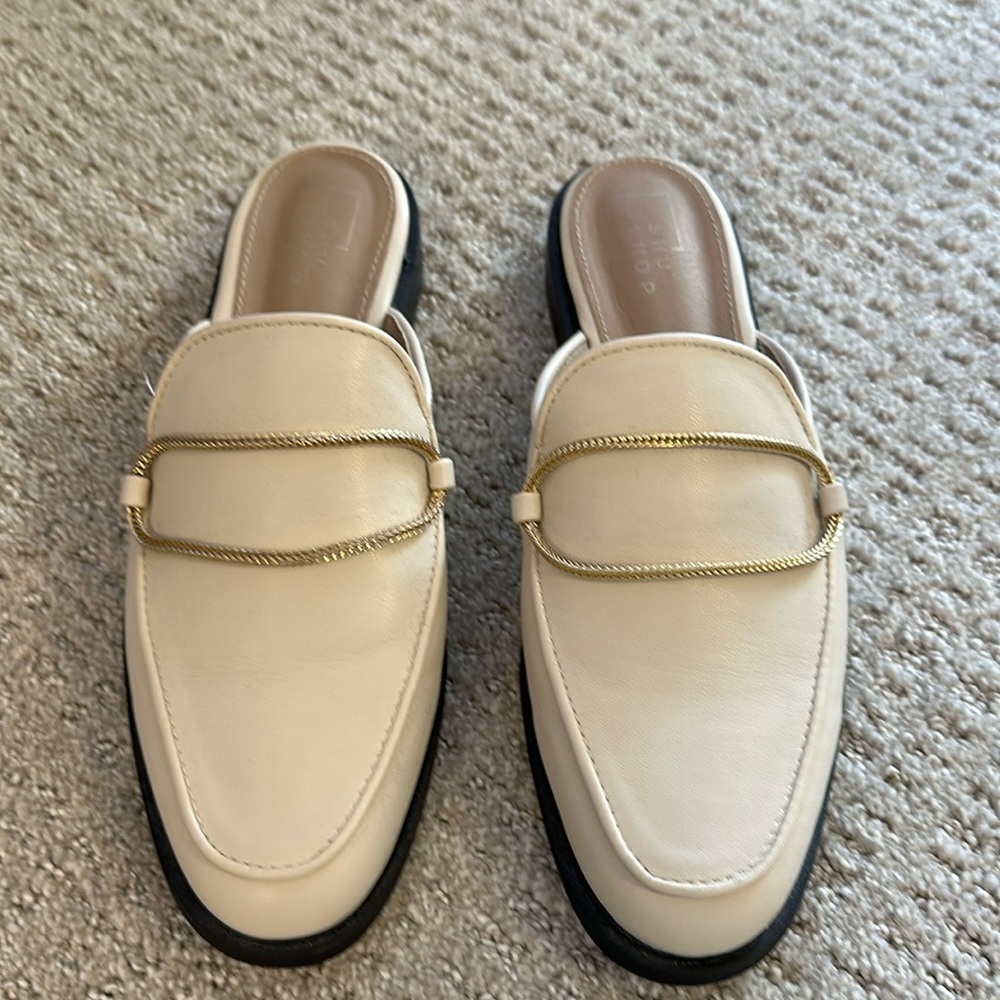Shu Shop mules with gold chain accent